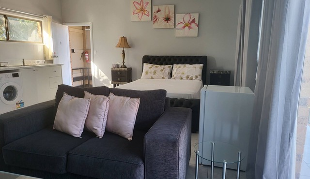 Top View Deluxe Self-Contained Room No 3 with Balcony Overlooking Swimming Pool.