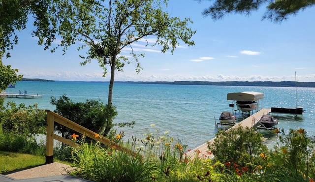 TorchLakeFlightDeck.com cottage with 180’ on Lakefront Waterfront Beachfront!