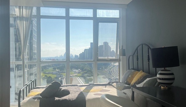 Toronto CN Tower lakeshore condo 1+1 2BR stunning Lake & City pink Sunset