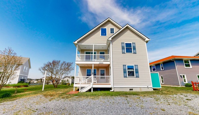 Town of Ocean View canal-front home with dock, kayaks, balconies, grill, & AC