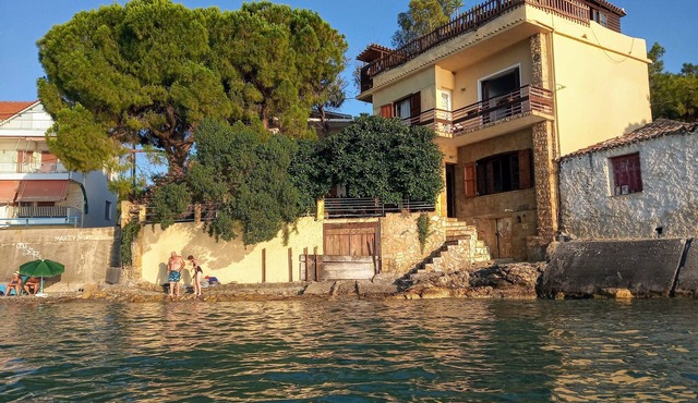 Traditional house over the sea wave