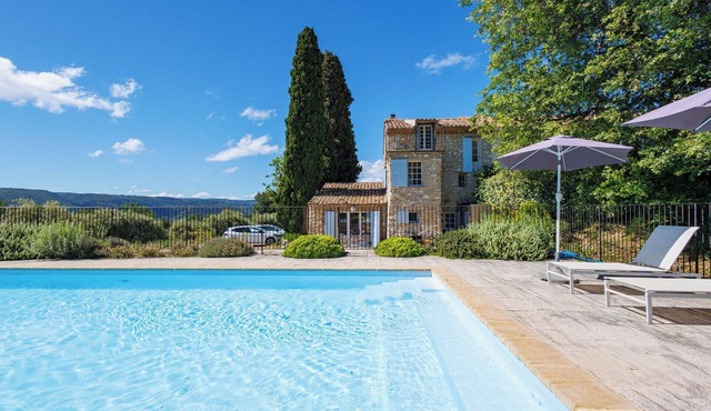 Traditional Provencal farmhouse with pool set among vines and olives