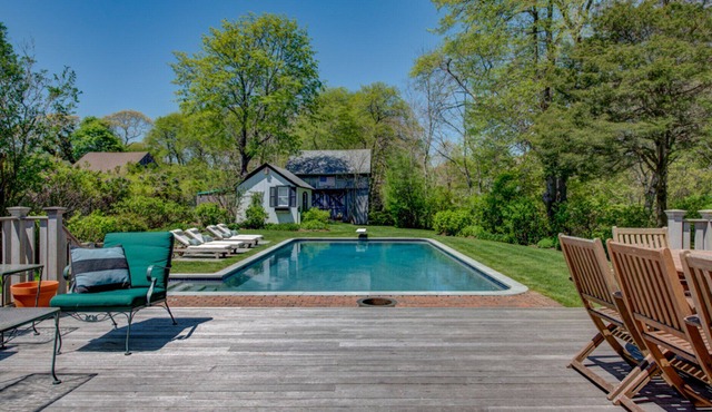 Traditional-style home with private pool, several sitting rooms, back deck,...
