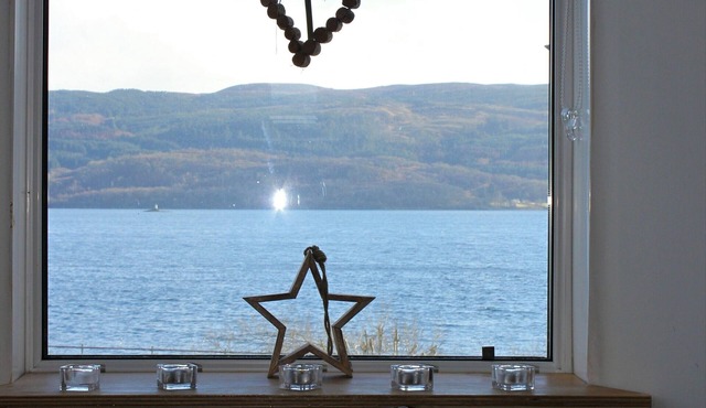 Traditional whitewashed fisherman's cottage overlooking Loch Fyne