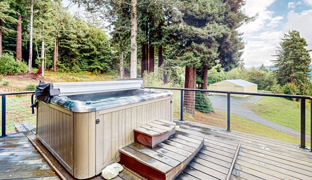 Tranquil and luxe river stay with wraparound deck, hot tub, sauna, & mtn views
