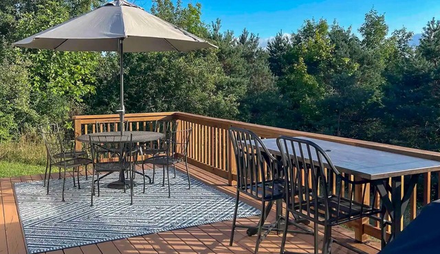 Tranquil cottage with furnished deck, washer/dryer, & fireplace