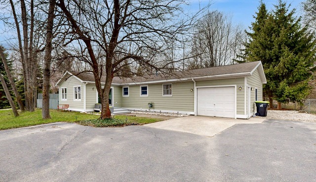 Tranquil Lakeview Retreat in Suttons Bay, with a private sauna, & large yard