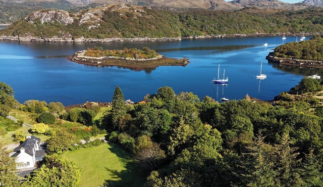 Tranquil modern home, stunning sea and mountain views, private shoreline access.