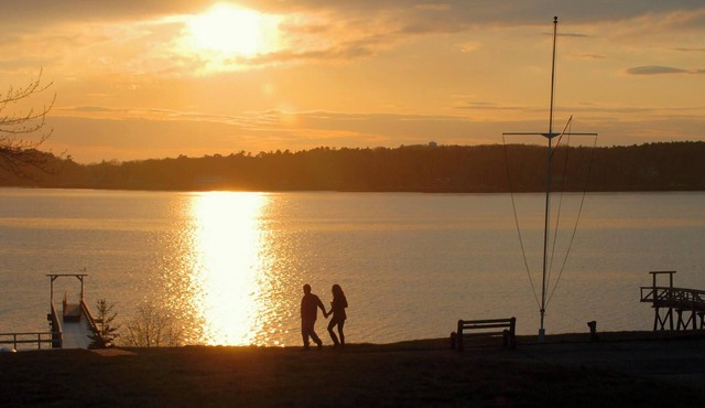Tranquil! Oceanfront Sunsets with costal beach at low tide with pier and dock.
