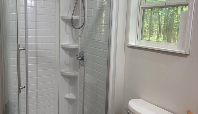 Tranquil tiny cabin situated in private wooded setting. Hiking trail and firepit