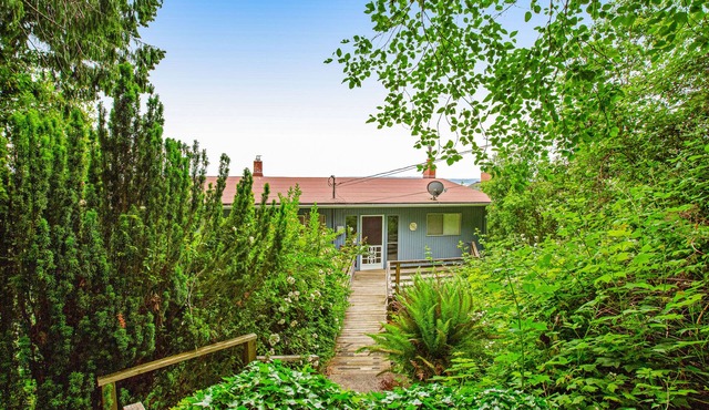 Tranquil waterfront getaway with inviting outdoor decks & beach access