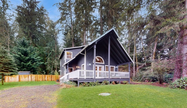 Tree-lined Anderson Island home with porch & fenced yard, near dock/tennis
