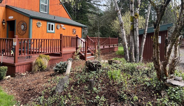 Tree-lined retreat with a wood stove, grill, firepit, & mountain views - dogs ok