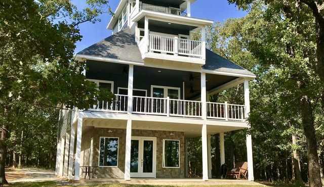 Tree Top Lake Views with lake access for swimming fishing boating 250 ft away!