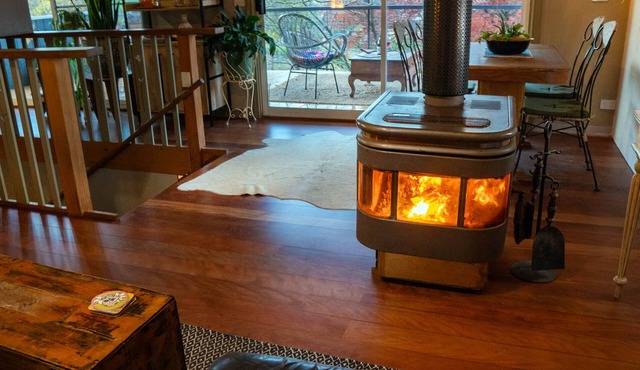 Tree Tops Apt @ Dreamers features log fire, mountain + pool views thru tree tops