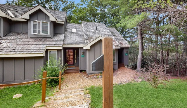 Treetop condo near golf + skiing with deck, grill, fireplace, & washer/dryer