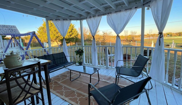 Trendy home with a scenic back porch, fish, golf and more