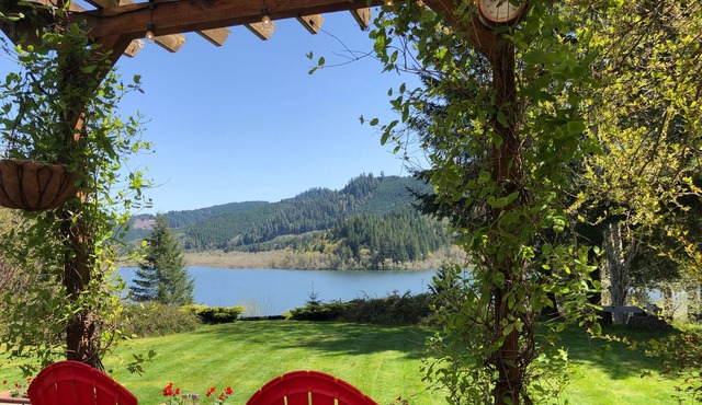 Triangle Lake View Home Nestled Amongst Trees on a hilltop Overlooking the Lake