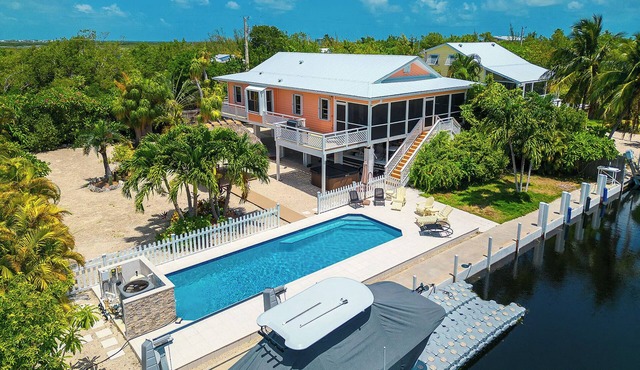 Tropical Oasis with Beautiful Home, Pool, Dock and Tiki Hut