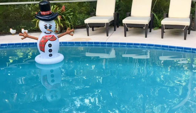 Tropical Oasis With HEATED Pool, Just minutes from the Downtown and the Beaches.