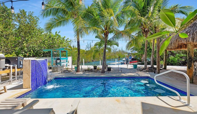 Tropical paradise on canal in Lower Keys-pool, tiki, firepit, dock, dog friendly