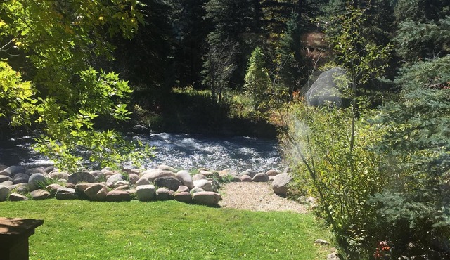 True Colorado Log home backing to the river