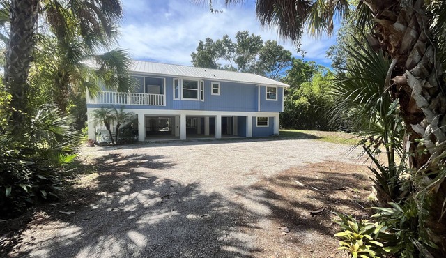 Tucked Away on Wooded Way located blocks from Manasota Beach with Heated Pool.