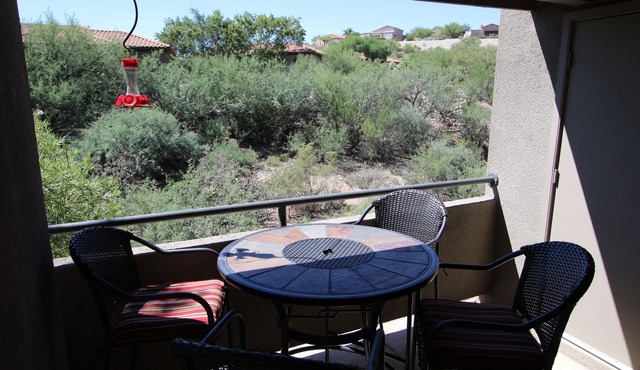 Tucson flair in this 2nd floor-serene patio -close to main pool- exercise rm
