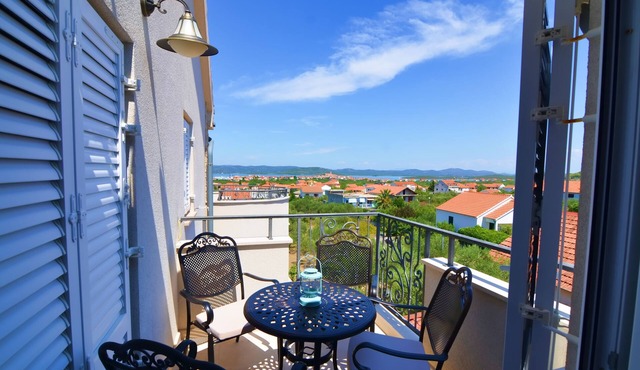 Two bedroom apartment with terrace and sea view Murter (A-16655-d)