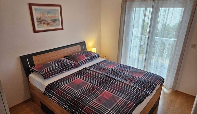 Two bedroom apartment with balcony and sea view Barbat (Rab) (A-4951-c)