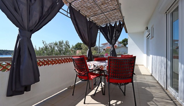 Two bedroom apartment with terrace and sea view Barbat, Rab (A-14247-a)