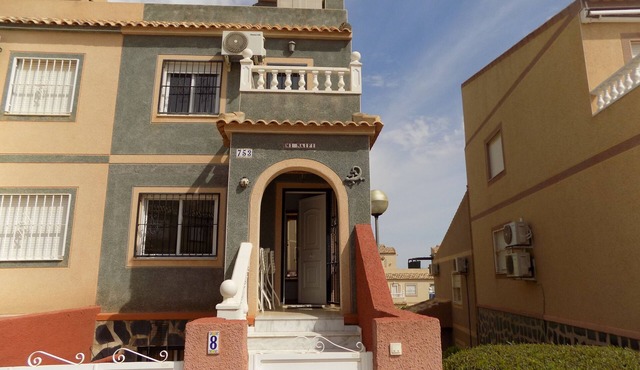 Two bedroom Town house with basement, aircon, communal pool, wifi and sea views