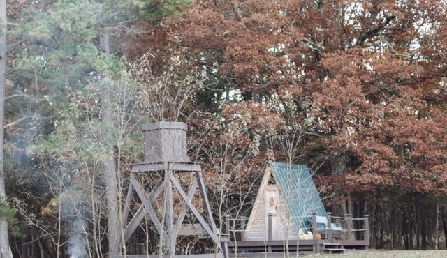 Two cozy pods with water tower