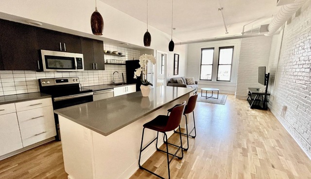 Two historic lofts across the hall from one another in the Old Market (4 bedrooms and 4 baths)