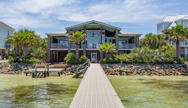 Two kitchens, 2 living areas, 5 beds, 4 baths & game room! Soundfront pool