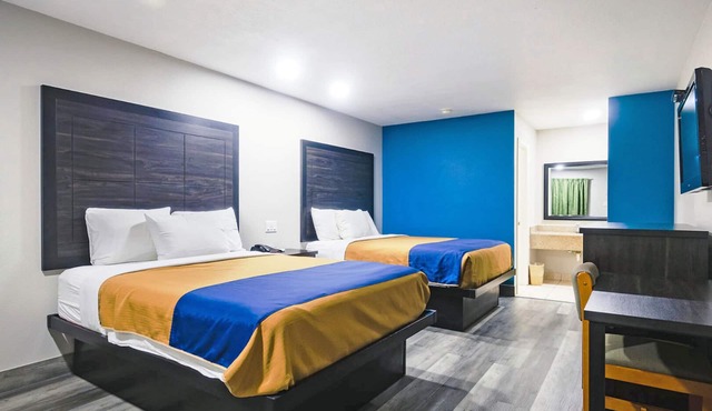 Two Queen Beds Kitchenette Non-Smoking Room at Scottish Inns and Suites!