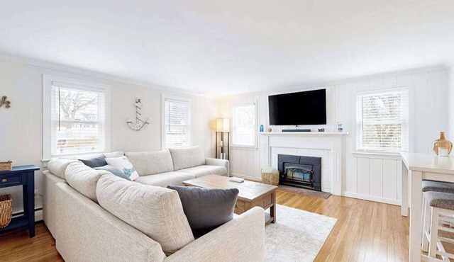 Two-story dog-friendly retreat with enclosed yard, playset, W/D, & firepit