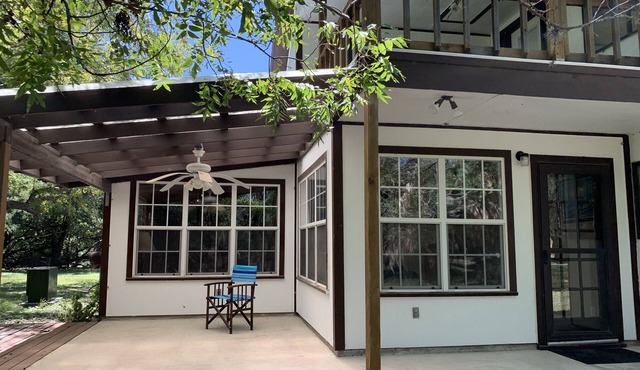 Two story home with Las Moras Creek views