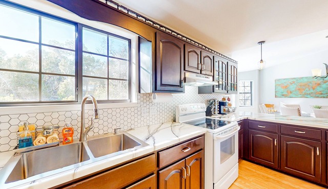 Two-story home with large deck, private bbq grill, and scenic views