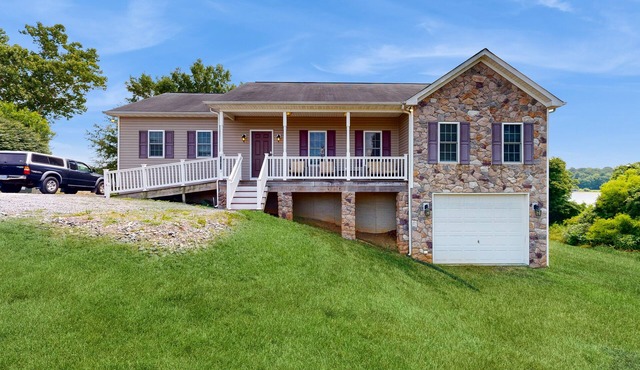 Two-story, lakefront getaway with dock, beach, grill, 2 kayaks, 2 canoes, AC