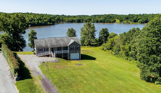 Two-story, lakefront getaway with dock, beach, grill, 2 kayaks, 2 canoes, AC