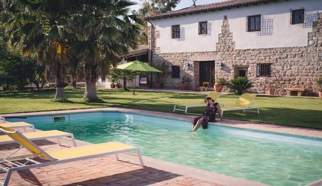 Typical Andalusian farmhouse surrounded by olive and fruit trees