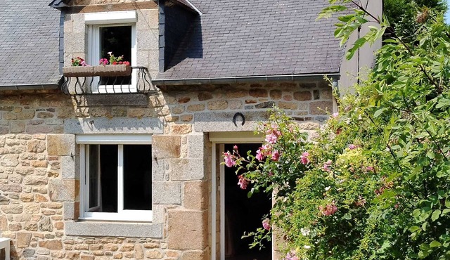Typical Breton house with garden near the sea and the Bay of Saint Brieuc