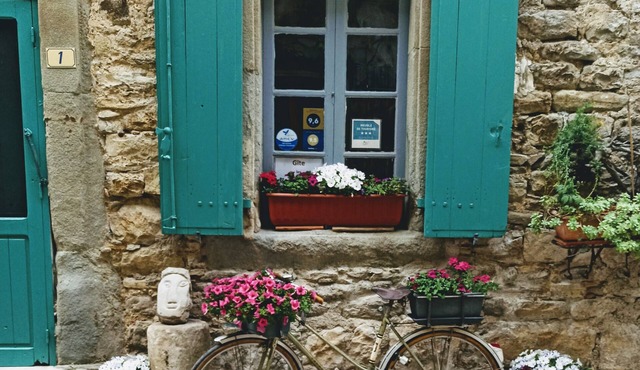 Typical stone house, in a small cobbled street, behind the chateau of Cesseras.