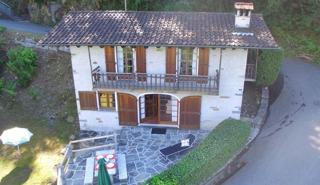 Typical Ticino house in an elevated position in Gambarogno