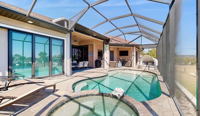 Ultimate waterside retreat with private dock, lanai, pool & spa, BBQ and WiFi