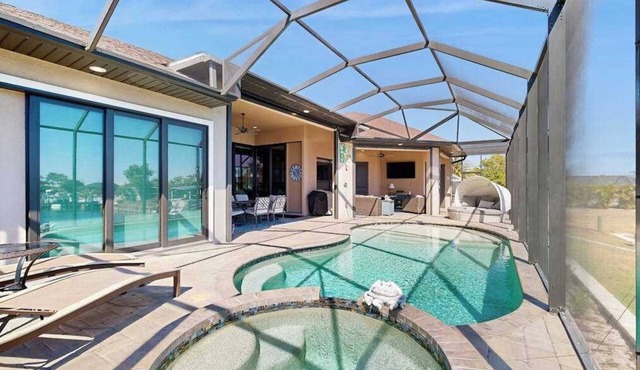 Ultimate waterside retreat with private dock, lanai, pool & spa, BBQ and WiFi
