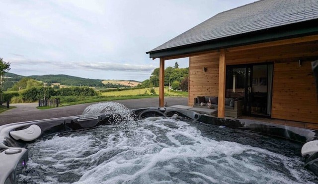 Unique 3 bed cabin with hot tub on Welsh border.