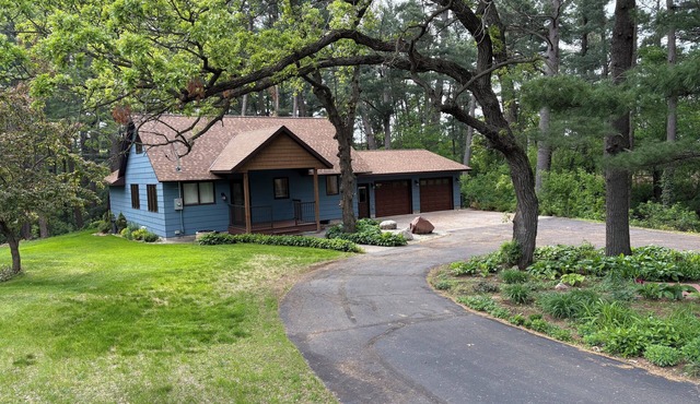 Unique getaway near Pierz Fish Lake with a hot tub and screened porch.