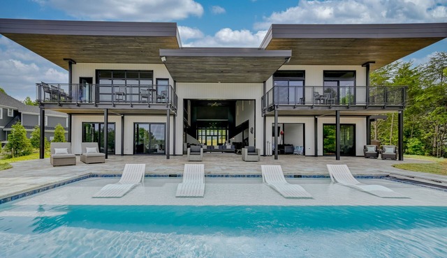 Unique lake house with infinity pool, hot tub, modern interior, & views